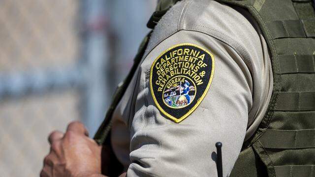 A California correctional officer stands at a gate on the grounds of Valley State Prison in Chowchilla, Calif., in July 2021. The U.S. Department of Justice announced Thursday, March 26, 2026, that it was investigating the policy of housing transgender persons in women’s prisons in California and Maine. A California correctional officer stands at a gate on the grounds of Valley State Prison in Chowchilla, Calif., in July 2021. The U.S. Department of Justice announced Thursday, March 26, 2026, that it was investigating the policy of housing transgender persons in women’s prisons in California and Maine.